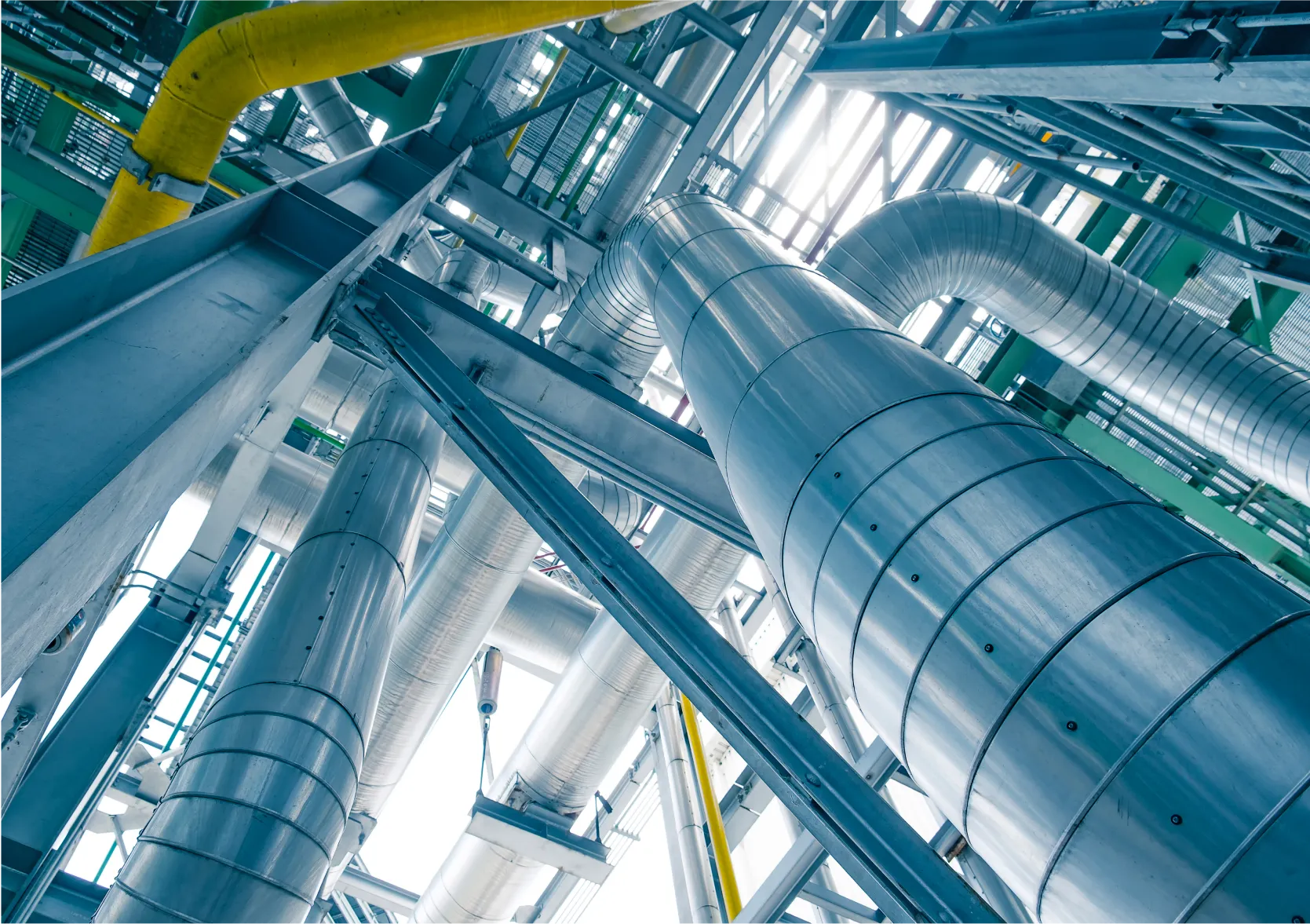 High-pressure stainless steel pipes and ducting in a modern industrial plant